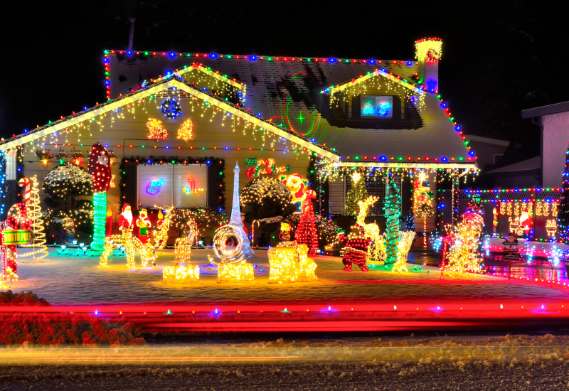 a well lit home with custom christmas lighting designs