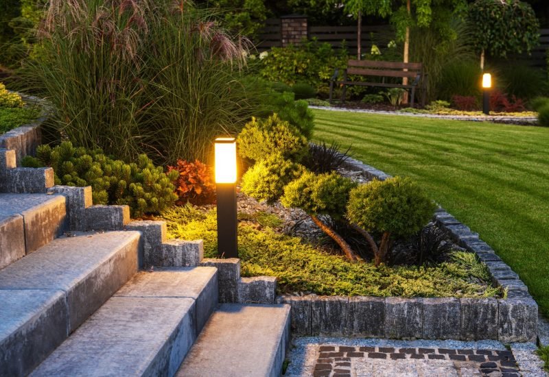 outdoor yellow lighting beside the staircase
