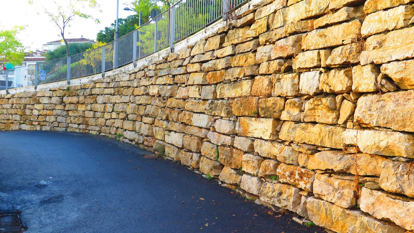 a retaining wall beside the street