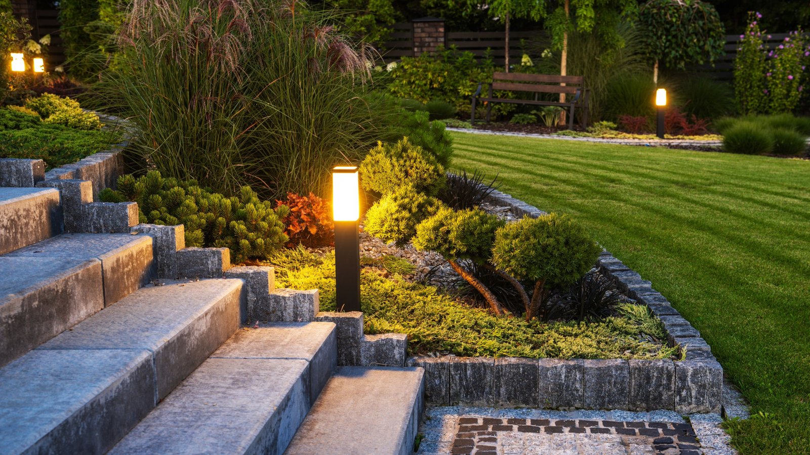 outdoor yellow lighting beside the staircase