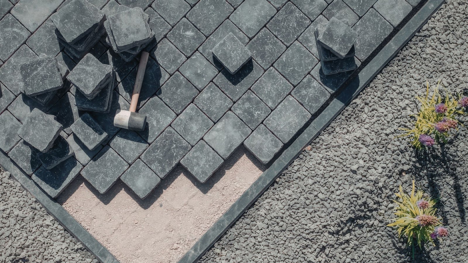 stone brick and hammer for unfinished patio installation