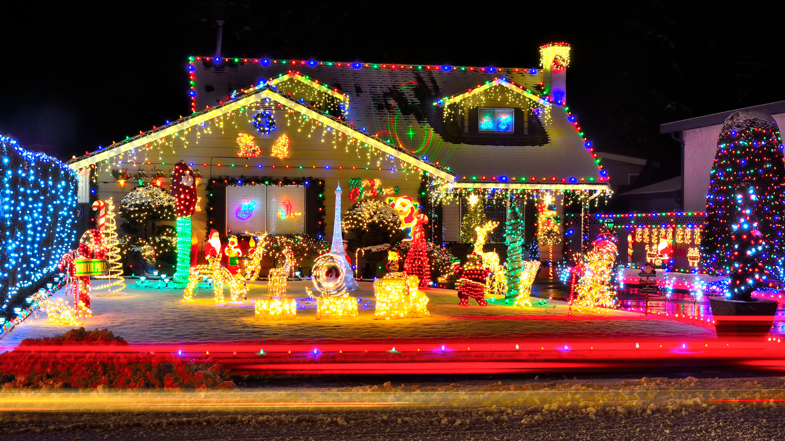 a well lit home with custom christmas lighting designs